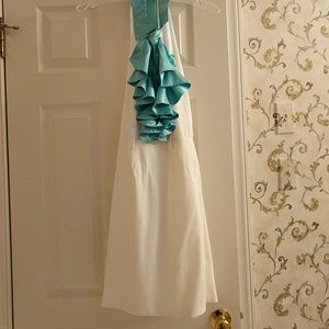 White dress with blue ruffles